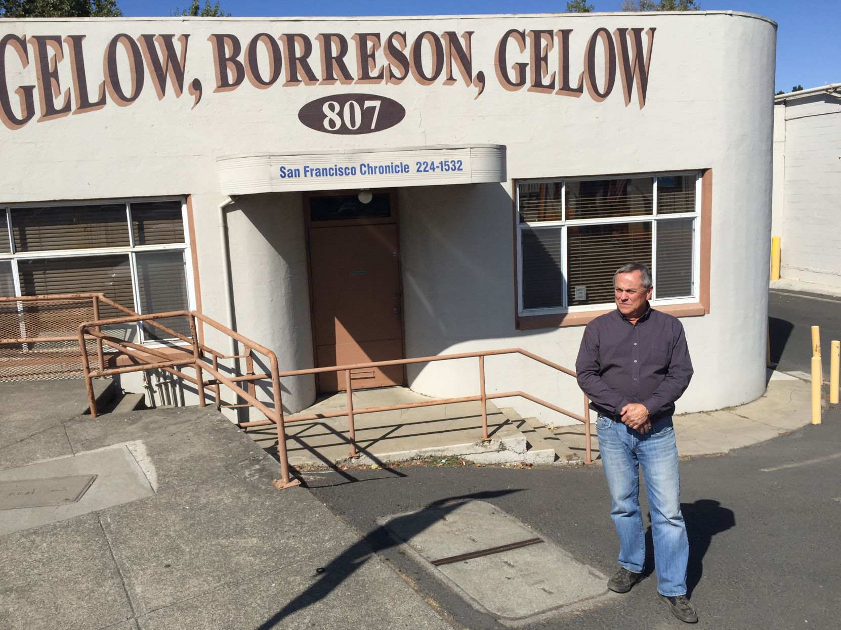 The building home to two newspaper distributorships has been sold to Michael L. Holcomb